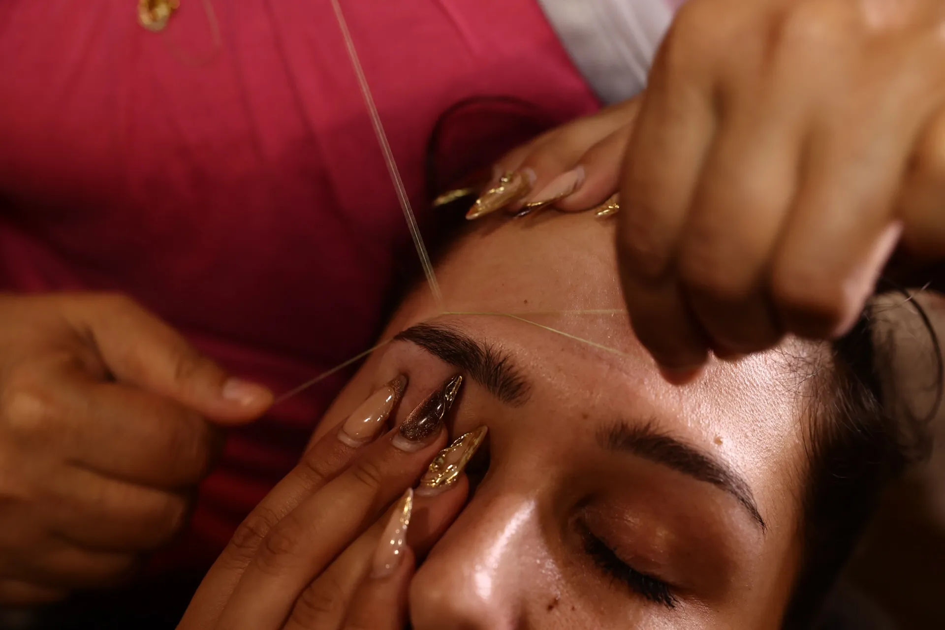 Precise eyebrow threading treatment at Touch N Glow